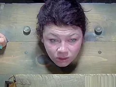 Restrained sub whipped while anally hooked